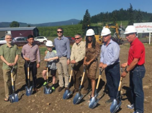 Individuals with shovels gather for the Know Your Fruit facility groundbreaking